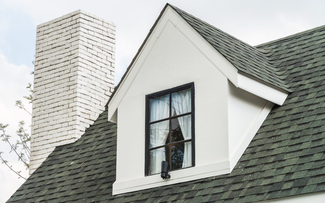 exterior of residential home with shingle roof tiles